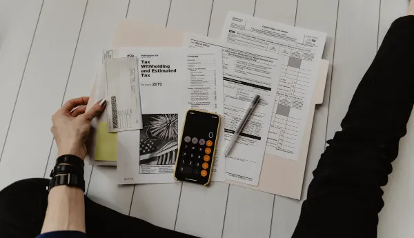 Reviewing paperwork and calculating a personal loan with Charter Funding